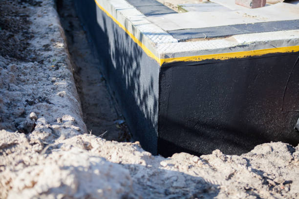 Professional Waterproofing technician working in Loretto, TN